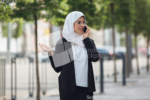 Image of Beautiful muslim successful businesswoman portrait, confident happy CEO