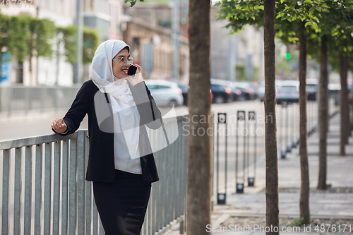 Image of Beautiful muslim successful businesswoman portrait, confident happy CEO
