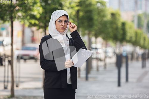Image of Beautiful muslim successful businesswoman portrait, confident happy CEO