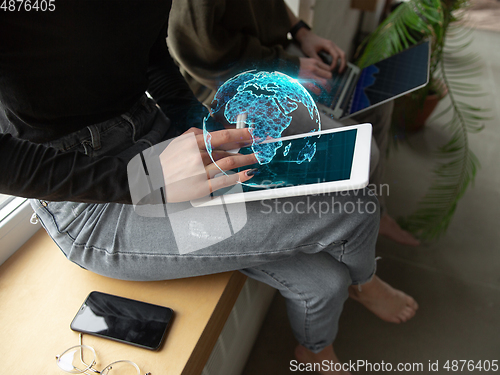 Image of Close up female hands connecting and sharing social media. Modern UI icons, communication, devices