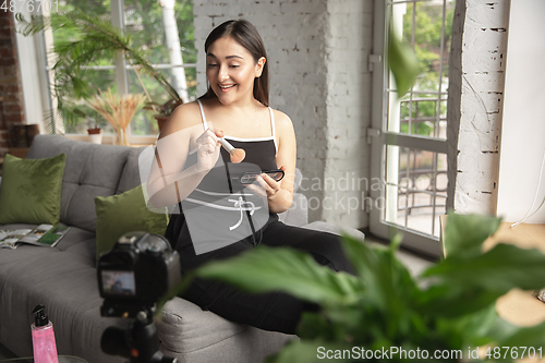 Image of Caucasian blogger woman make vlog how to be body positive and taking beauty treatment. Lifestyle, influencer women, healthy concept.