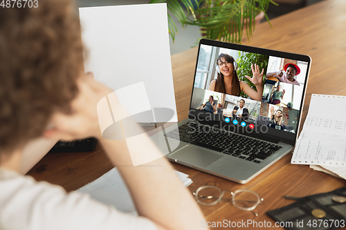 Image of Man participate video conference looking at laptop screen during virtual meeting, videocall webcam app for business, close up