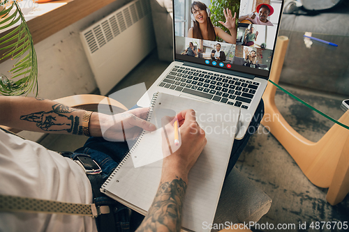 Image of Man participate video conference looking at laptop screen during virtual meeting, videocall webcam app for business, close up