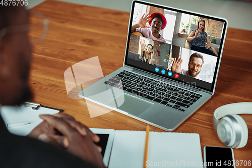 Image of Man participate video conference looking at laptop screen during virtual meeting, videocall webcam app for business, close up