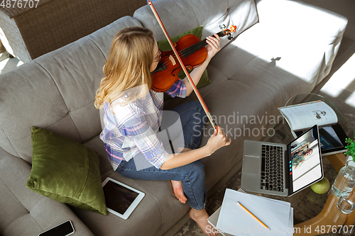 Image of Woman participate video conference looking at laptop screen during virtual meeting, videocall webcam app for business, close up