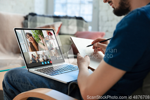 Image of Man participate video conference looking at laptop screen during virtual meeting, videocall webcam app for business, close up