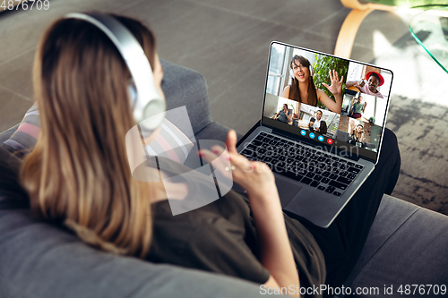 Image of Woman participate video conference looking at laptop screen during virtual meeting, videocall webcam app for business, close up
