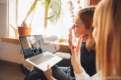 Image of Women participate video conference looking at laptop screen during virtual meeting, videocall webcam app for business, close up