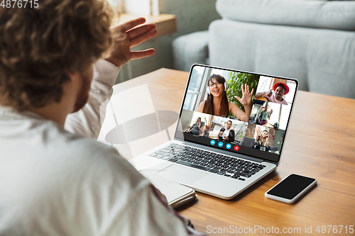 Image of Man participate video conference looking at laptop screen during virtual meeting, videocall webcam app for business, close up