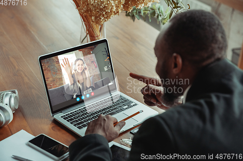 Image of Man participate video conference looking at laptop screen during virtual meeting, videocall webcam app for business, close up