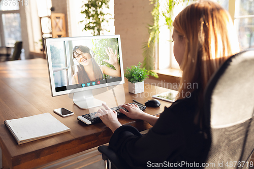 Image of Woman participate video conference looking at laptop screen during virtual meeting, videocall webcam app for business, close up