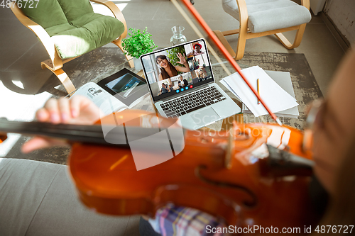 Image of Woman participate video conference looking at laptop screen during virtual meeting, videocall webcam app for business, close up