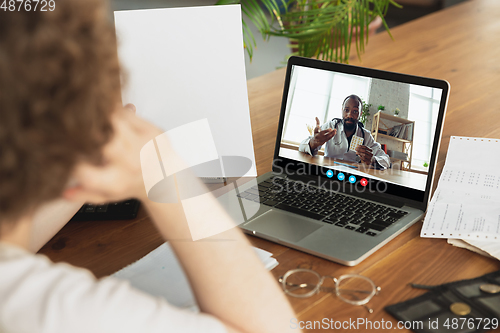 Image of Man participate video conference looking at laptop screen during virtual meeting, videocall webcam app for business, close up