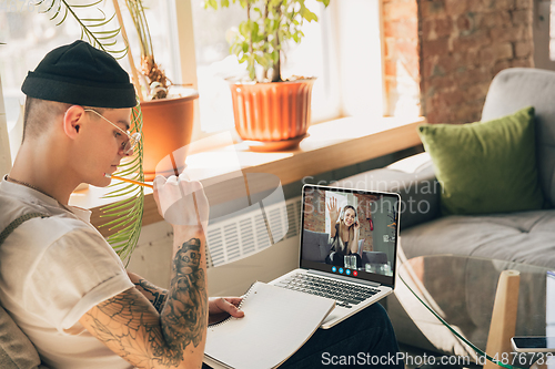 Image of Man participate video conference looking at laptop screen during virtual meeting, videocall webcam app for business, close up