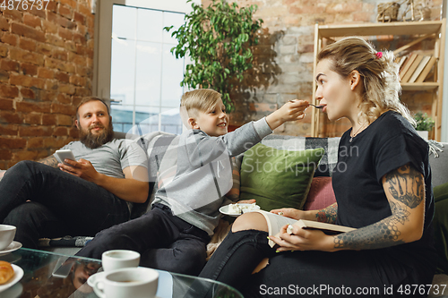 Image of Happy family at home spending time together. Having fun, look cheerful and lovely.