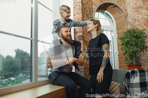 Image of Happy family at home spending time together. Having fun, look cheerful and lovely.