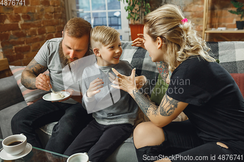 Image of Happy family at home spending time together. Having fun, look cheerful and lovely.
