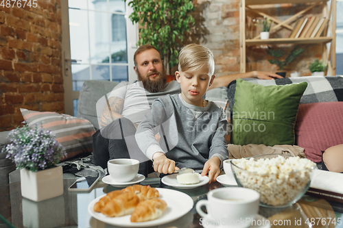 Image of Happy family at home spending time together. Having fun, look cheerful and lovely.