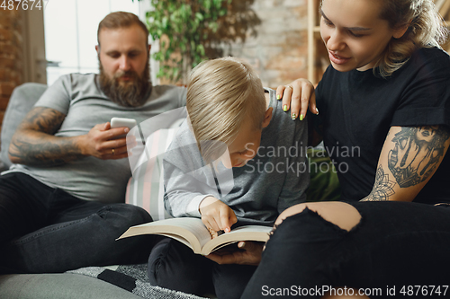 Image of Happy family at home spending time together. Having fun, look cheerful and lovely.