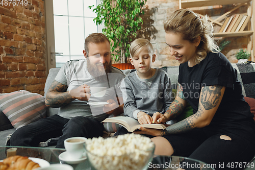 Image of Happy family at home spending time together. Having fun, look cheerful and lovely.