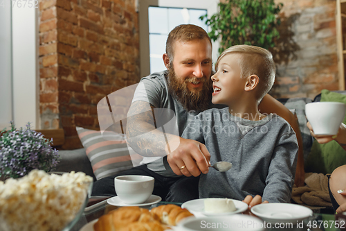 Image of Happy family at home spending time together. Having fun, look cheerful and lovely.