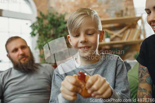 Image of Happy family at home spending time together. Having fun, look cheerful and lovely.