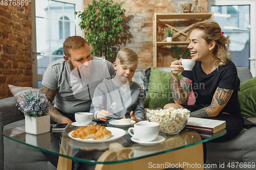 Image of Happy family at home spending time together. Having fun, look cheerful and lovely.