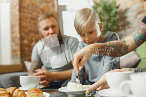 Image of Happy family at home spending time together. Having fun, look cheerful and lovely.