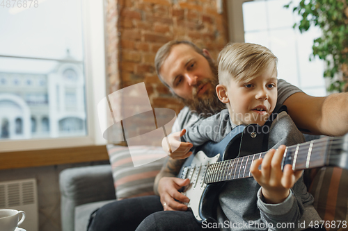 Image of Happy family at home spending time together. Having fun, look cheerful and lovely.