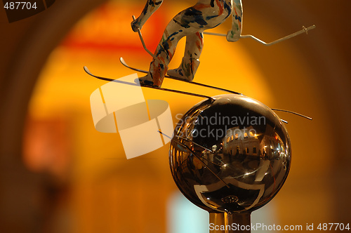 Image of Skier statue over silver ball