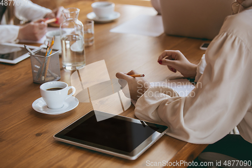 Image of Business young caucasian woman in modern office with team