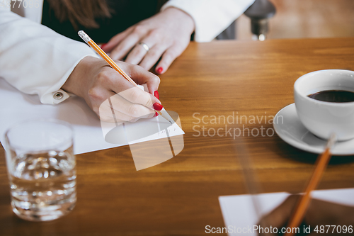 Image of Business young caucasian woman in modern office with team