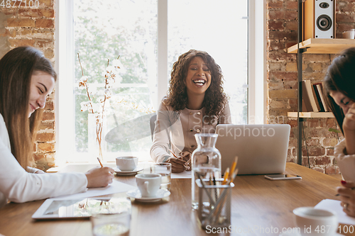 Image of Business young caucasian woman in modern office with team