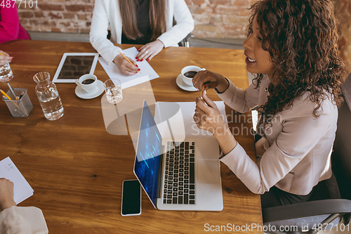 Image of Business young caucasian woman in modern office with team