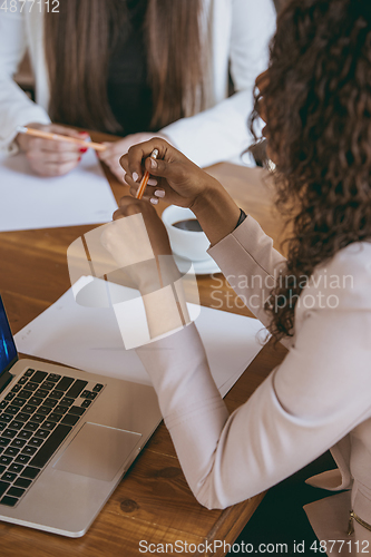 Image of Business young caucasian woman in modern office with team