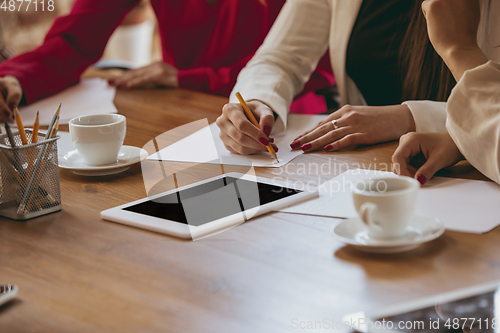 Image of Business young caucasian woman in modern office with team