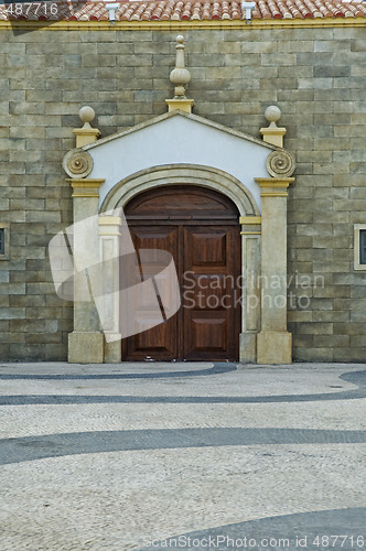 Image of The front view of a stone house