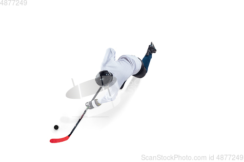 Image of Unrecognizable male hockey player with the stick on ice court and white background