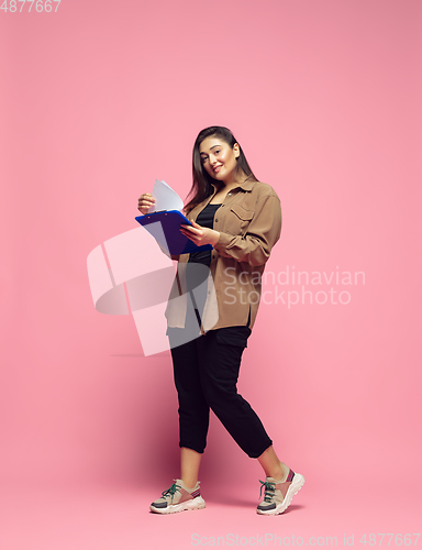 Image of Young caucasian woman in casual wear. Bodypositive female character. plus size businesswoman