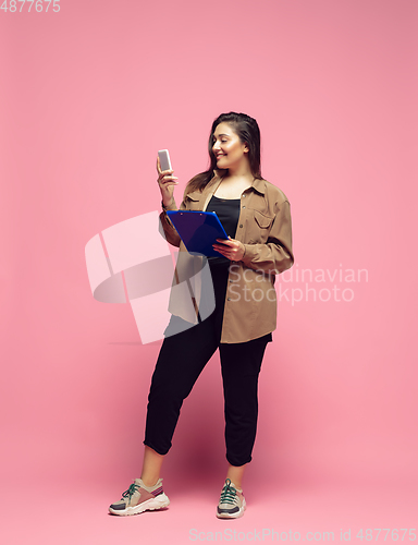 Image of Young caucasian woman in casual wear. Bodypositive female character. plus size businesswoman