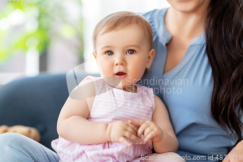 Image of portrait of little baby girl with happy mother