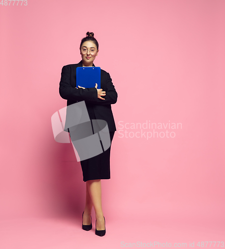 Image of Young caucasian woman in office attire. Bodypositive female character. plus size businesswoman