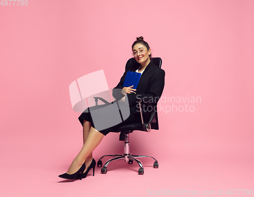 Image of Young caucasian woman in office attire. Bodypositive female character. plus size businesswoman