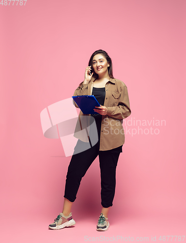 Image of Young caucasian woman in casual wear. Bodypositive female character. plus size businesswoman