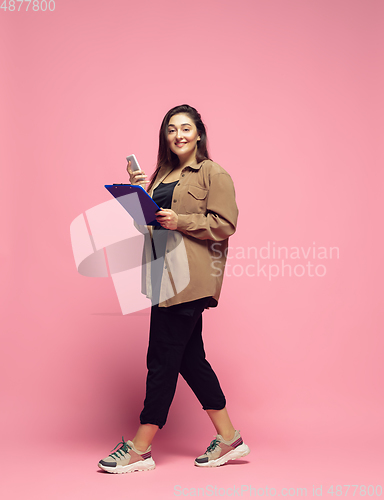 Image of Young caucasian woman in casual wear. Bodypositive female character. plus size businesswoman