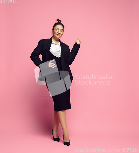 Image of Young caucasian woman in office attire. Bodypositive female character. plus size businesswoman