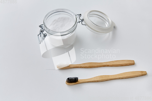 Image of washing soda and wooden toothbrushes