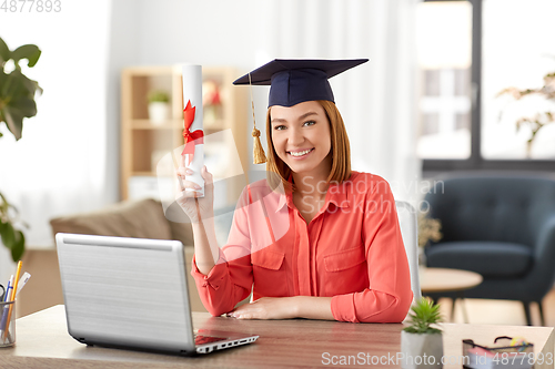 Image of student woman with laptop and diploma at home