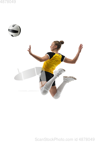 Image of Young female volleyball player isolated on white studio background. Woman in sport\'s equipment training and practicing.