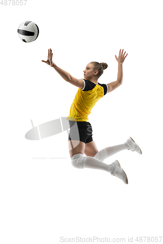 Image of Young female volleyball player isolated on white studio background. Woman in sport\'s equipment training and practicing.